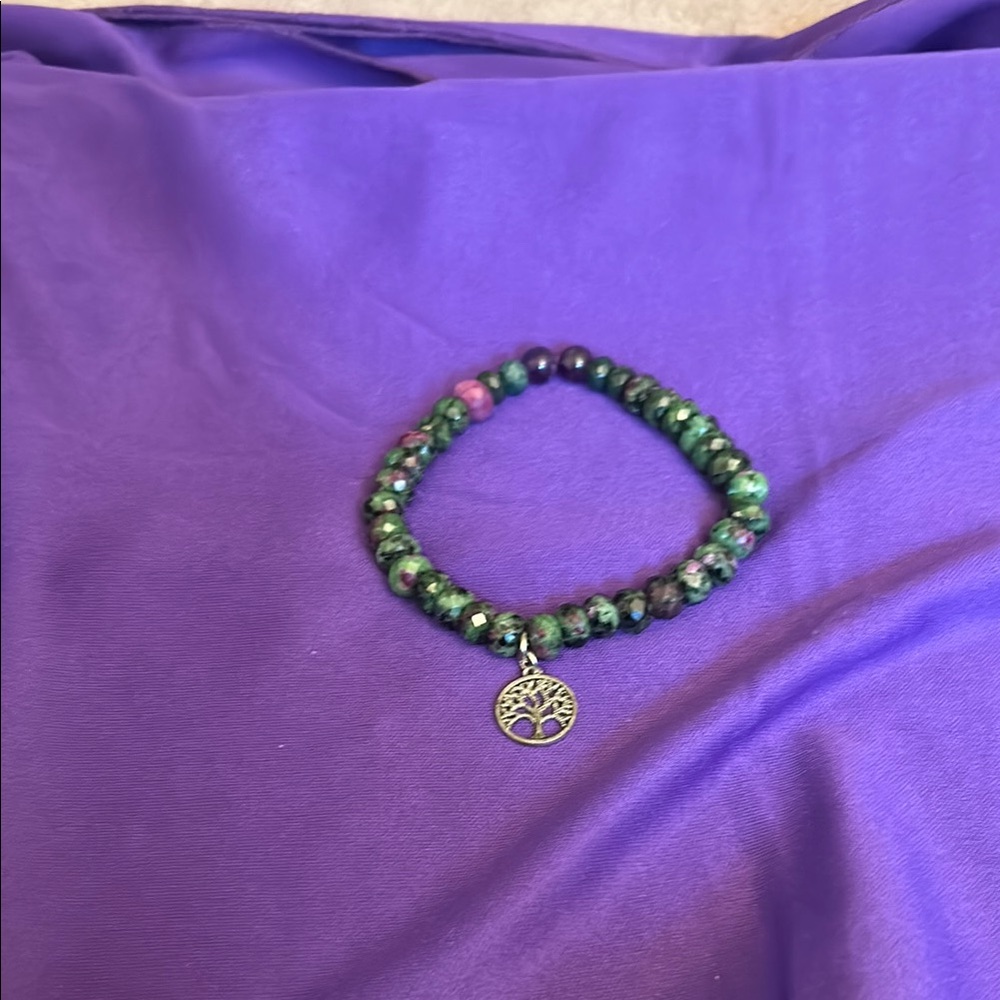 Green Beaded Bracelet with Silver Charm